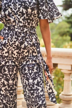 Black & White Mono Print Satin Angel Sleeve Wide Leg Jumpsuit -SOSANDAR Sales web 2307 83 s23jw038bkcv01 83 230