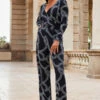Black Geometric Print Faux Wrap Front Jumpsuit 1 Black Geometric Print Faux Wrap Front Jumpsuit -SOSANDAR Sales web 2307 84 a20jj004bkge01 84 005